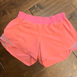 - neon pink lululemon shorts